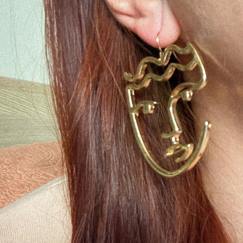 Abstract face gold earring